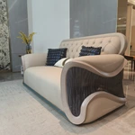 Cream Diamond-Tufted Leather Sofa with Scroll Armrests and Dark High-Gloss Wood Sides